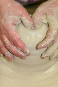 After centering the clay it is "opened".