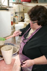 After first "bisque" firing. Step 1: Pouring glaze into the vase.